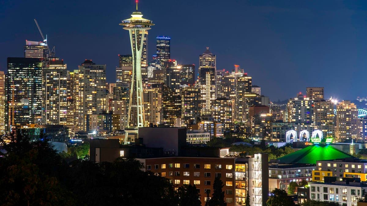 The Seattle skyline at night with the Space Needle lit up